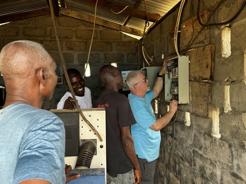 Michael Newton repairing electrical systems Liberia 03.24 second angle